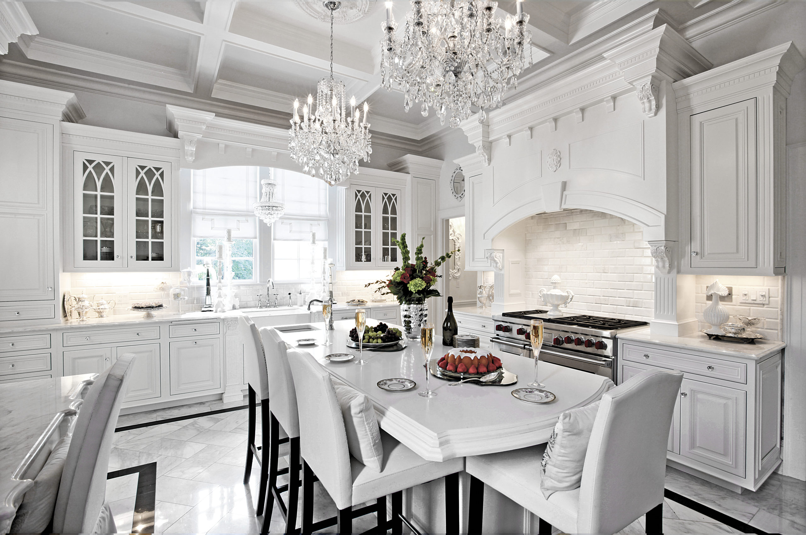 Rutt Cabinetry white kitchen with chandeliers